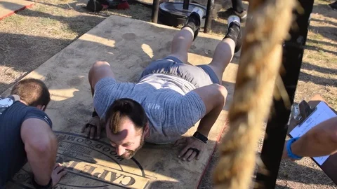 Athletic caucasian men doing press ups, push ups at a cross fit Stock Footage 103107225