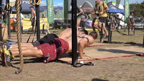 Athletic caucasian men doing press ups, push ups at a cross fit Stock Footage 106070835