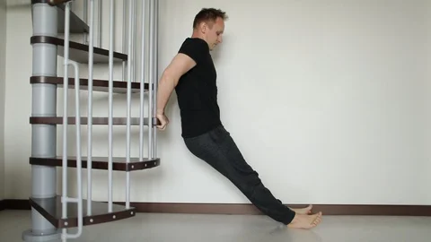 Athletic confident man doing exercises at home. Young fit Man is doing push-ups Stock-Footage 130018617