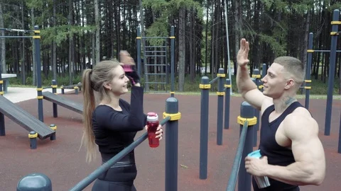 Athletic couple giving high five after finishing their training. Stock Footage 111966773