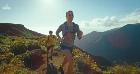 Athletic couple running on mountain trail, healthy fitness lifestyle Stock Footage 149644224