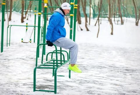 Athletic exercise in the winter Park Stock Photos