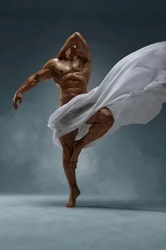 Athletic faceless man posing in a studio with a white cloth in an original way Stock Photos