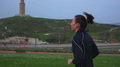 An athletic girl does a run in the fresh air. Stock Footage 197042880