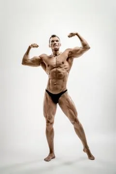 Athletic guy - bodybuilder,  pose on white background Foto stock