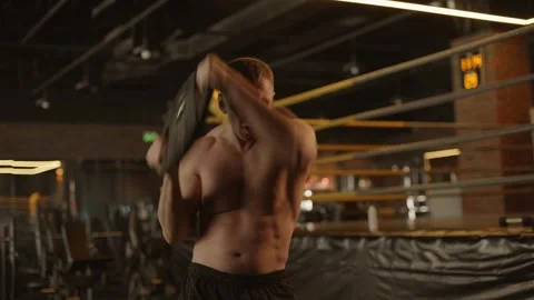 Athletic guy doing exercises in the gym Weight Plate Circuit Stock Footage 269133683