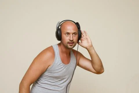 Athletic guy with headphones Stock Photos