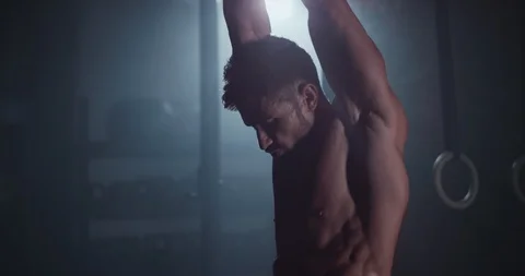 Athletic guy with perfect body in a cross fitness class have a hard workout Stock Footage 118604083