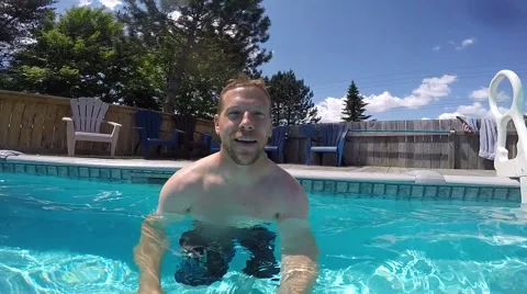 Athletic guy swimming around pool pov slo mo Stock Footage 52433003