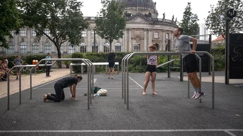 Athletic guys do workout in a city park in Berlin Video stock 114177023
