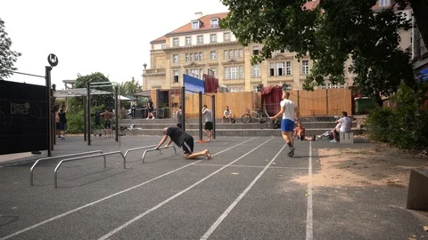 Athletic guys do workout in a city park in Berlin Video stock 114177150