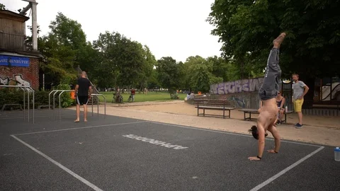 Athletic guys do workout in a city park in Berlin Video stock 114177599