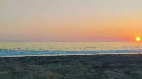 Athletic Handsome Man Jogging Against the Backdrop of a Beautiful Seascape.  Stock Footage 231141556