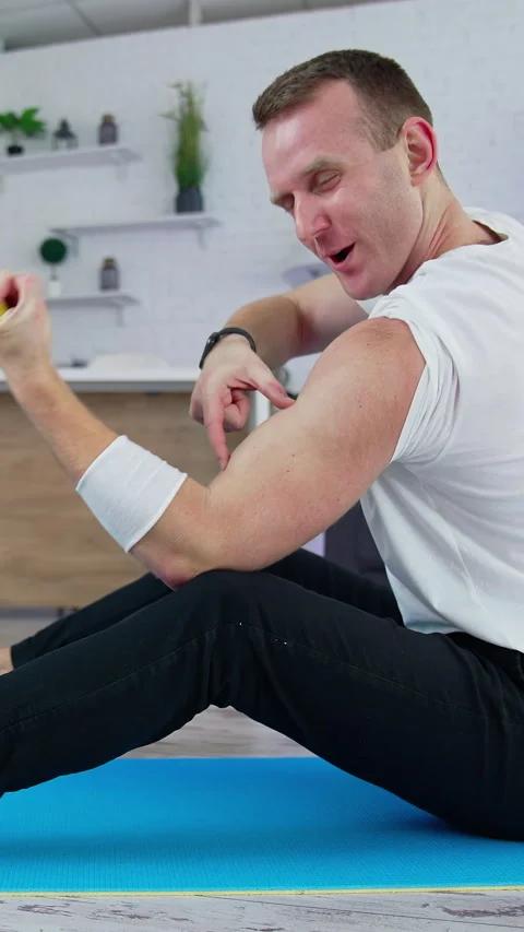 Athletic handsome man working out in home. Strong healthy man training indoor Stock Footage 318965268