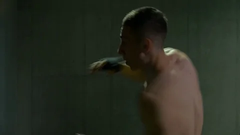 Athletic kick boxer working out throwing punches Stock Footage 77777458