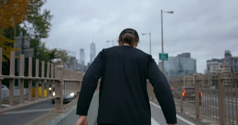 Athletic Male Going On A Run On Classic New York Road Towards Brooklyn Bridge Stock Footage 112555534