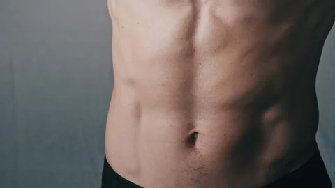 Athletic Man Demonstrating His Toned Six-Pack Abs Stock Footage 315796055