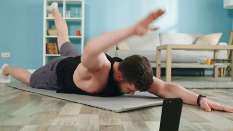 Athletic Man Is Doing Arm Leg Raises Stock Footage 138512567