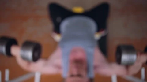 Athletic man doing chest workout with dumbbells Stock Footage 64317969