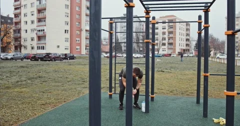 Athletic man doing chin ups Stock Footage 145347523