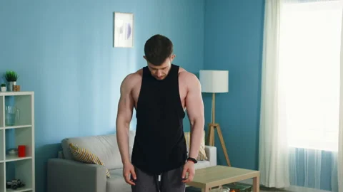 Athletic Man is Doing Morning Exercise Stock Footage 135532918