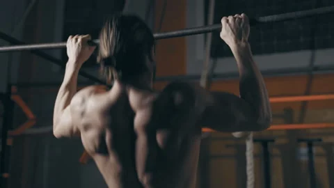 Athletic man doing pull ups Stock Footage 153035688