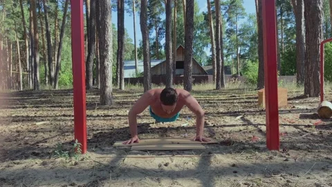Athletic man doing sports outside on a sunny day Stock Footage 229557403