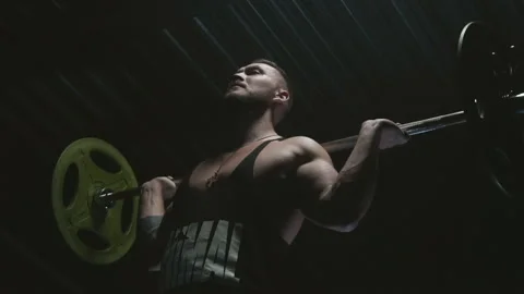 Athletic Man Doing Squats With Barbell Stock Footage 141947149