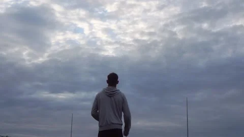 An athletic man doing warm-up of arms before jogging in the morning. Stock Footage 141073593