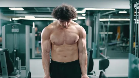 Athletic man doing weight lifting. Stock Footage 159751400