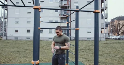 Athletic man drinking water from a plastic bottle Stock Footage 145347157