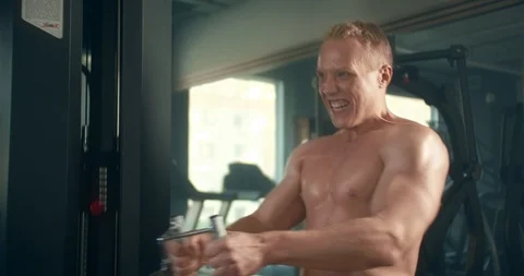 Athletic man engages in Thrust of the lower block to the stomach in the gym Stock Footage 126558812