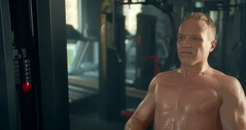 Athletic man engages in Thrust of the lower block to the stomach in the gym Stock Footage 127320418