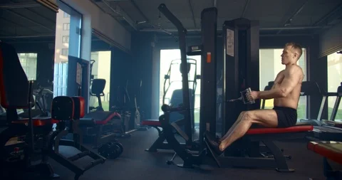 Athletic man engages in Thrust of the lower block to the stomach in the gym Stock Footage 127322452
