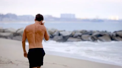 Athletic Man Exercising At The  Beach Video stock 202093557