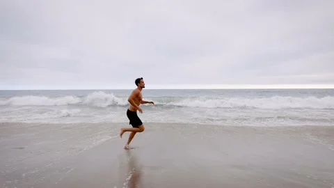 Athletic Man Exercising At The  Beach Video stock 219887687