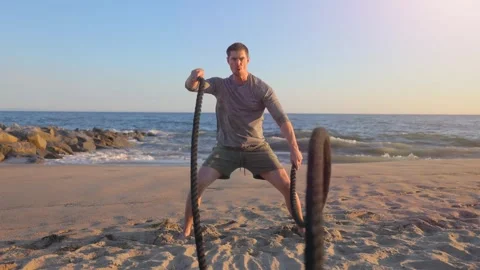 Athletic Man Exercising At The  Beach Stock Footage 254904748