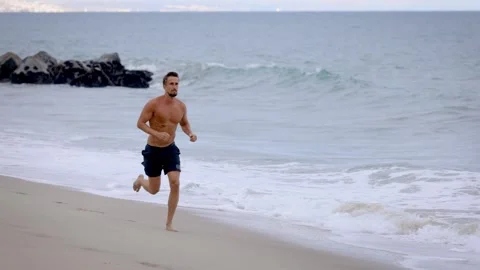 Athletic Man Exercising At The  Beach Video stock 335150402