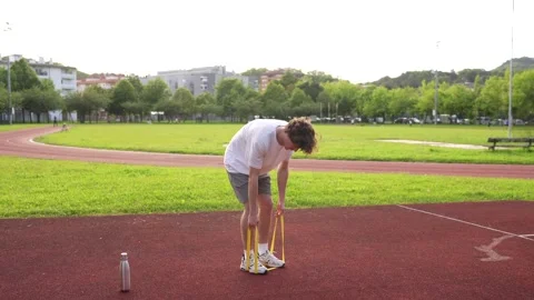 Athletic man exercising with an elastic band Stock Footage 299896450