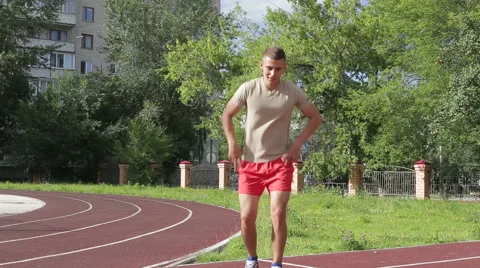 Athletic man exercising outdoors Stock Footage 65492207