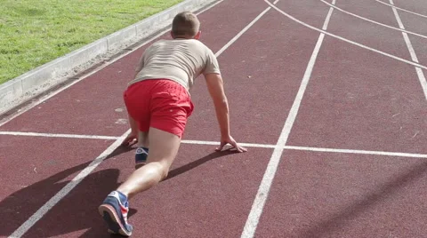 Athletic man exercising outdoors Stock Footage 65511184