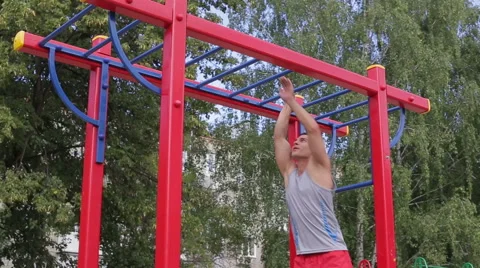 Athletic man exercising outdoors Stock Footage 65512156