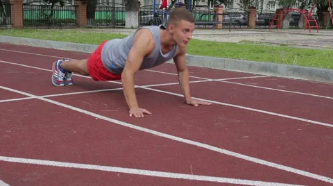 Athletic man exercising outdoors Stock Footage 65515885