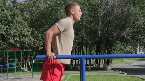 Athletic man exercising outdoors Stock Footage 65594780