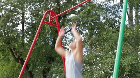 Athletic man exercising outdoors Stock Footage 65605761