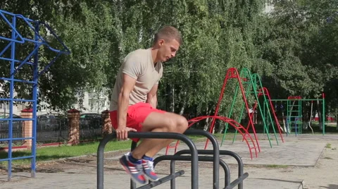 Athletic man exercising outdoors Stock Footage 65752694
