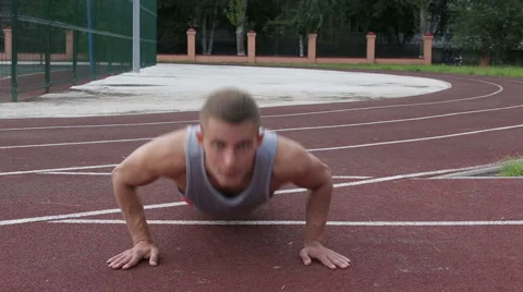 Athletic man exercising outdoors Stock Footage 65772368
