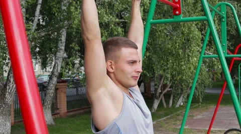 Athletic man exercising outdoors Stock Footage 65772678