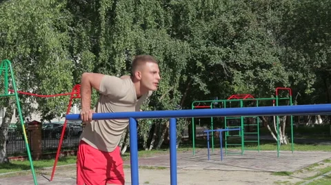 Athletic man exercising outdoors Stock Footage 65832418