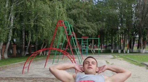 Athletic man exercising outdoors Stock Footage 65927979